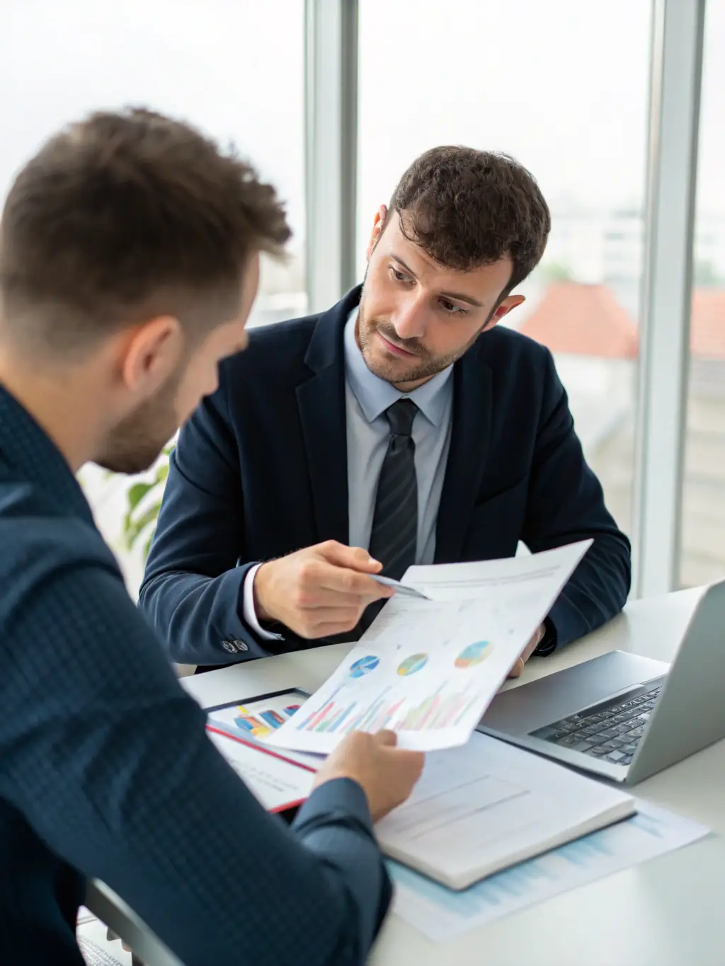 A dedicated account manager working closely with a client, demonstrating a client-focused approach.